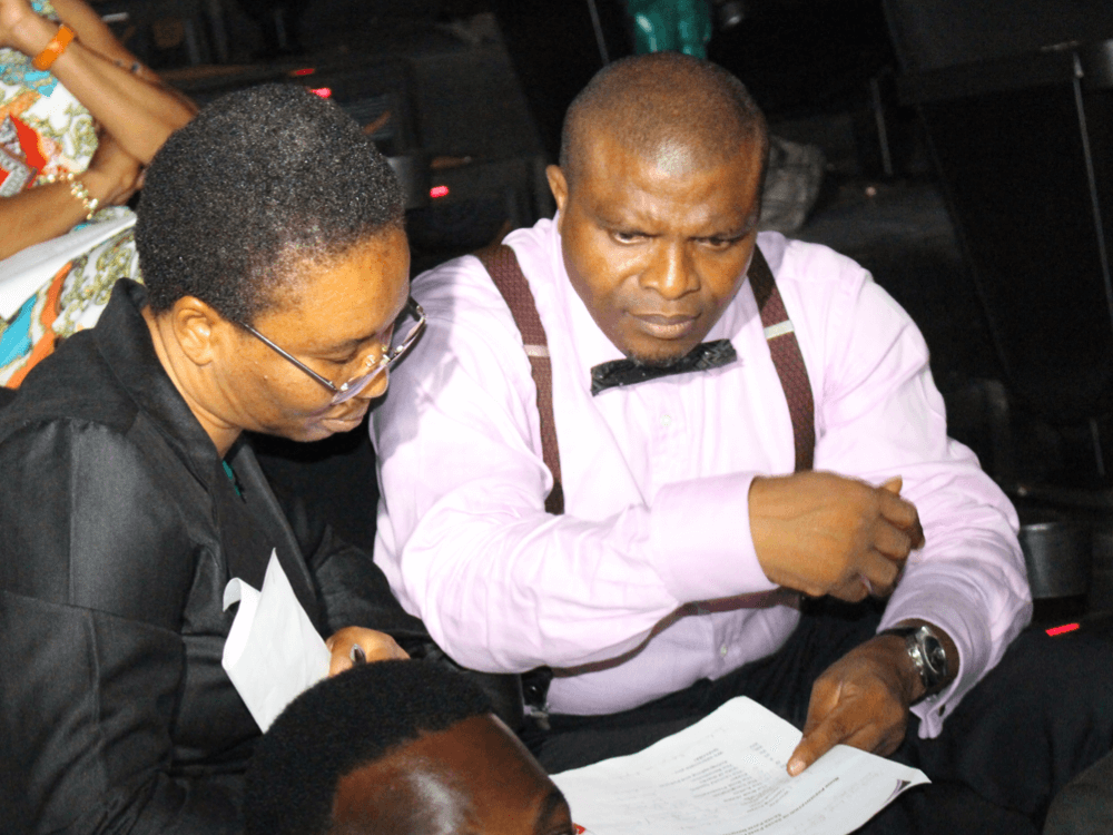 Reverend Olusegun and Clara Obafemi, brainstorming