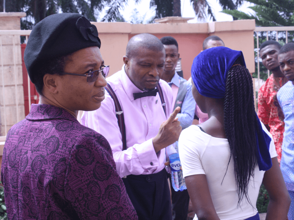 Reverend Olusegun and Clara Obafemi instructing a youth