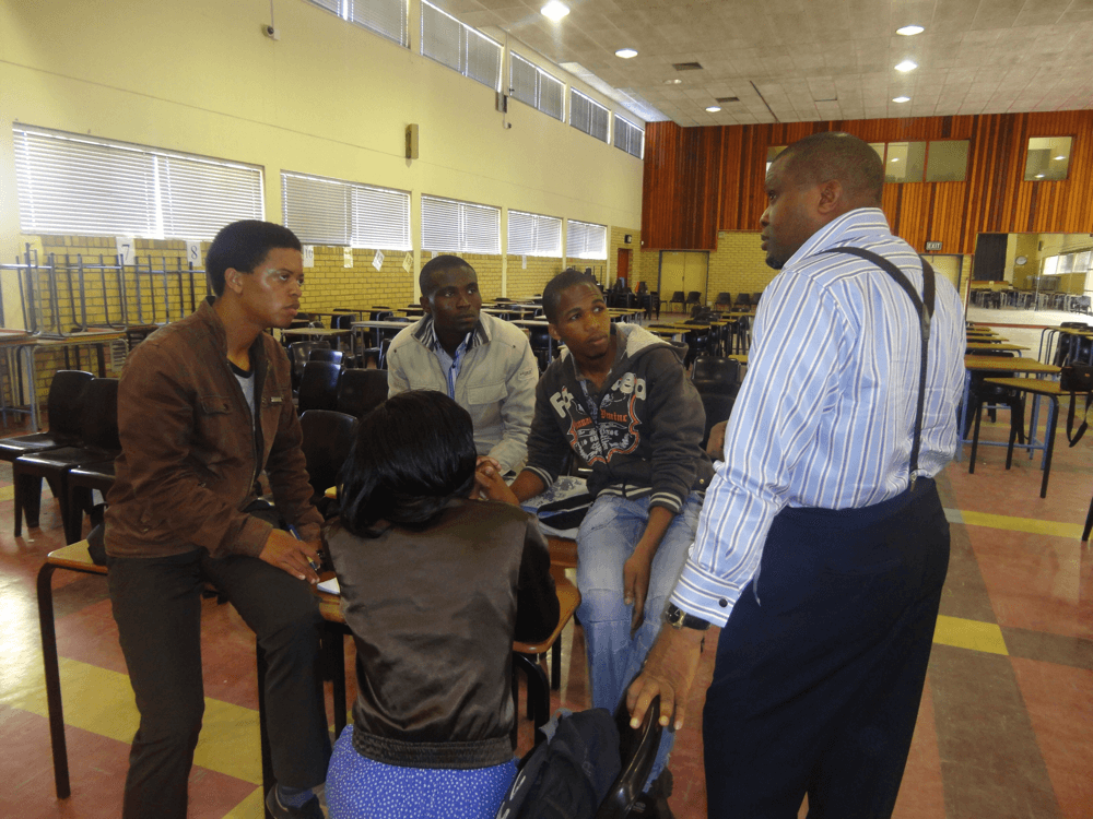 Reverend Olusegun Obafemi engaging youths in a discussion